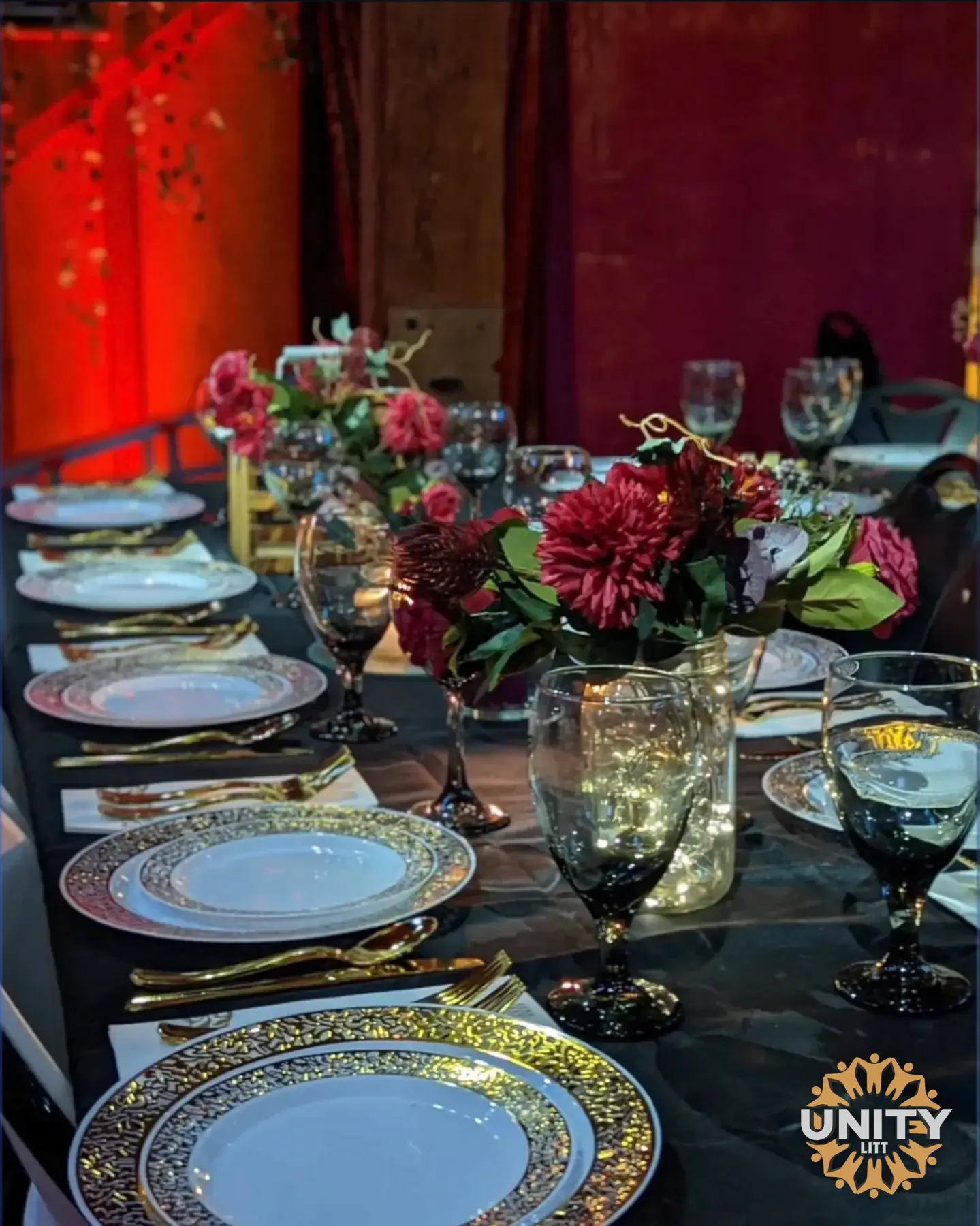 An elegant candlelit table set for the holiday meal
